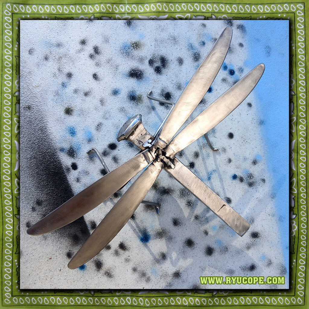 Steel dragonfly made from railroad spike, stainless steel rod, stainless steel butter knives