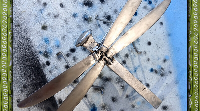 Steel dragonfly made from railroad spike, stainless steel rod, stainless steel butter knives